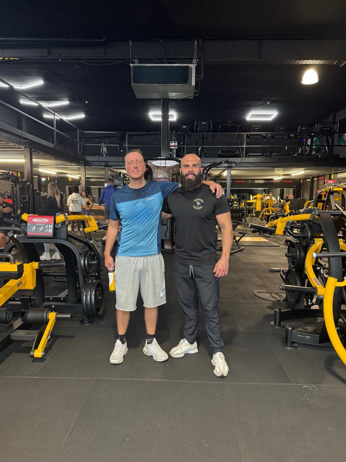 Stuart, a former programme participant, with Stephen Bell at the gym